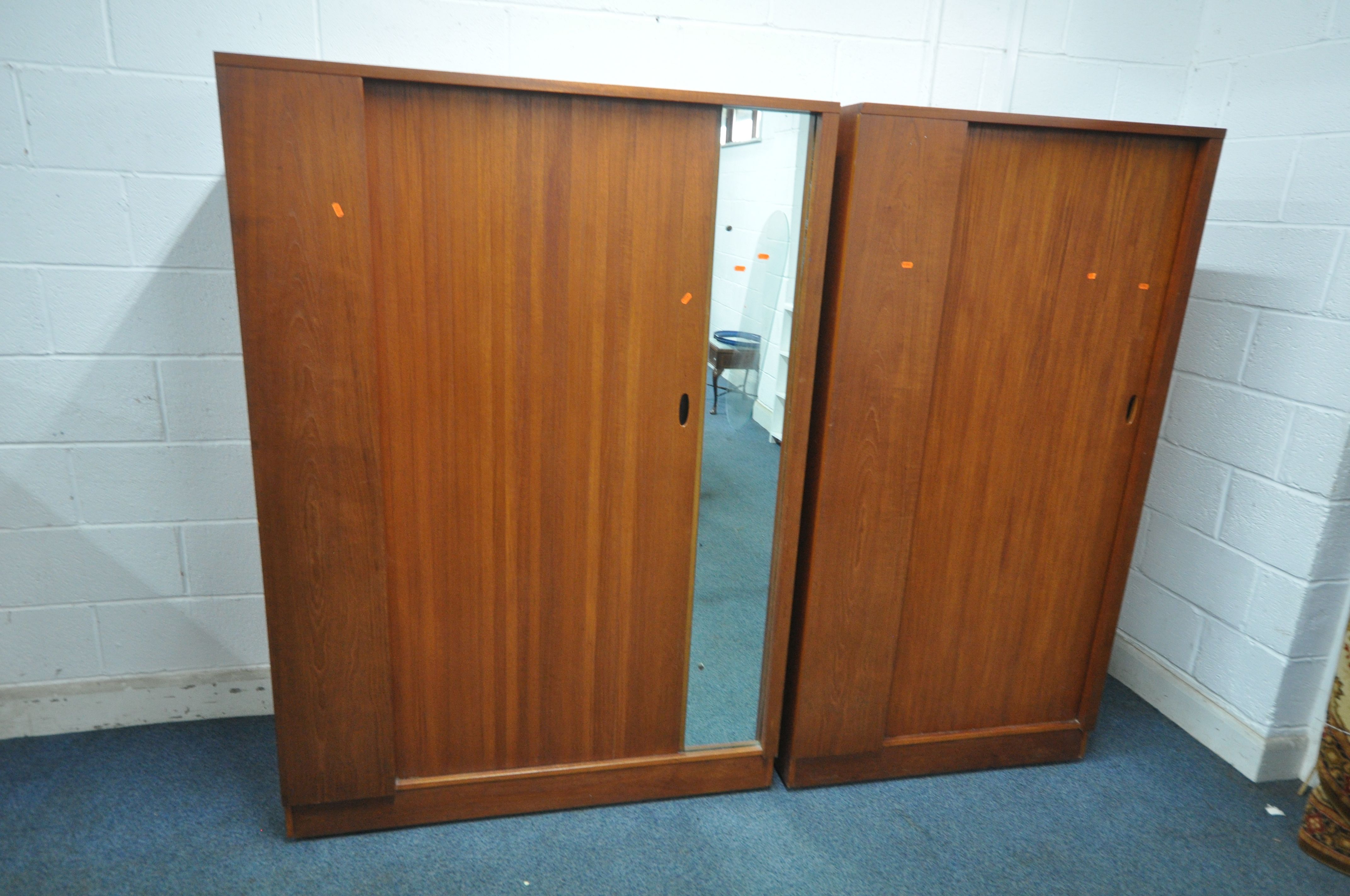 AN AUSTINSUITE MID CENTURY TEAK WARDROBE, with a single tambour sliding door and mirror, width 122cm