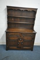 A 20TH CENTURY OAK DRESSER, the two tier plate rack atop a base that's fitted with two drawers,