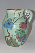 A CLARICE CLIFF 'PASSION FRUIT' SINGLE HANDLED LOTUS JUG, decorated with pink, blue and green
