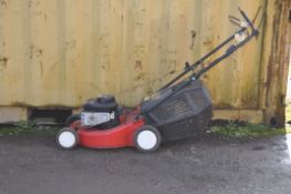 A CHAMPION 375SELF PROPELLED PETROL LAWN MOWER with collection box (starts and propels)
