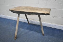 A RUSTIC CHOPPING BLOCK, on triple spindle legs, width 94cm x depth 41cm x height 72cm (condition