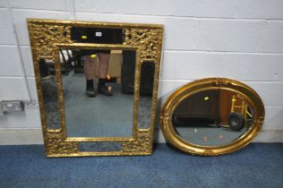 A RECTANGULAR GILT RESIN FRAMED WALL MIRROR, with foliate detail, 104cm x 84cm, along with an oval