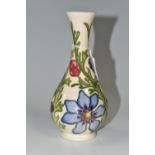 A MOORCROFT COLLECTORS CLUB FLORAL BUD VASE DECORATED IN THE ADONIS (PHEASANTS EYE) PATTERN,