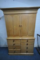 A 19TH CENTURY PINE HOUSEKEEPERS CUPBOARD, fitted with double cupboard doors, that are enclosing