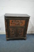 A 20TH CENTURY HARDWOOD ORIENTAL CARVED COCKTAIL CABINET, the hinged lid and fall front door,