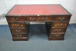 A 20TH CENTURY MAHOGANY TWIN PEDESTAL DESK, with an oxblood leather writing surface, fitted with