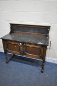 AN OAK BARLEY TWIST WASHSTAND, with a slate top and raised back, width 107cm x depth 46cm x height