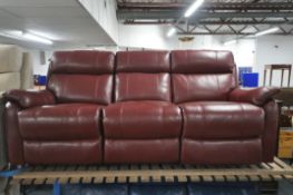 A RED LEATHER ELECTRIC THREE SEATER SOFA, with multiple buttons to recline, adjustable headrest,