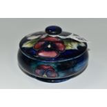 A MOORCROFT POTTERY PANSY DESIGN TRINKET POT, with cover, tube lined with purple and pink flowers on