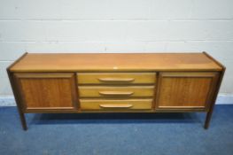 A MID-CENTURY TEAK SIDEBOARD consisting of three middle drawers and two cupboard doors, width