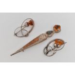 THREE BROOCHES, two white metal open work brooches of thistles set with faceted orange paste, both