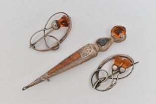 THREE BROOCHES, two white metal open work brooches of thistles set with faceted orange paste, both