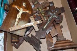 A BOX OF TWELVE WOODEN CRUCIFIXES, the Christ figures are made from either metal or resin, two