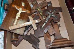 A BOX OF TWELVE WOODEN CRUCIFIXES, the Christ figures are made from either metal or resin, two