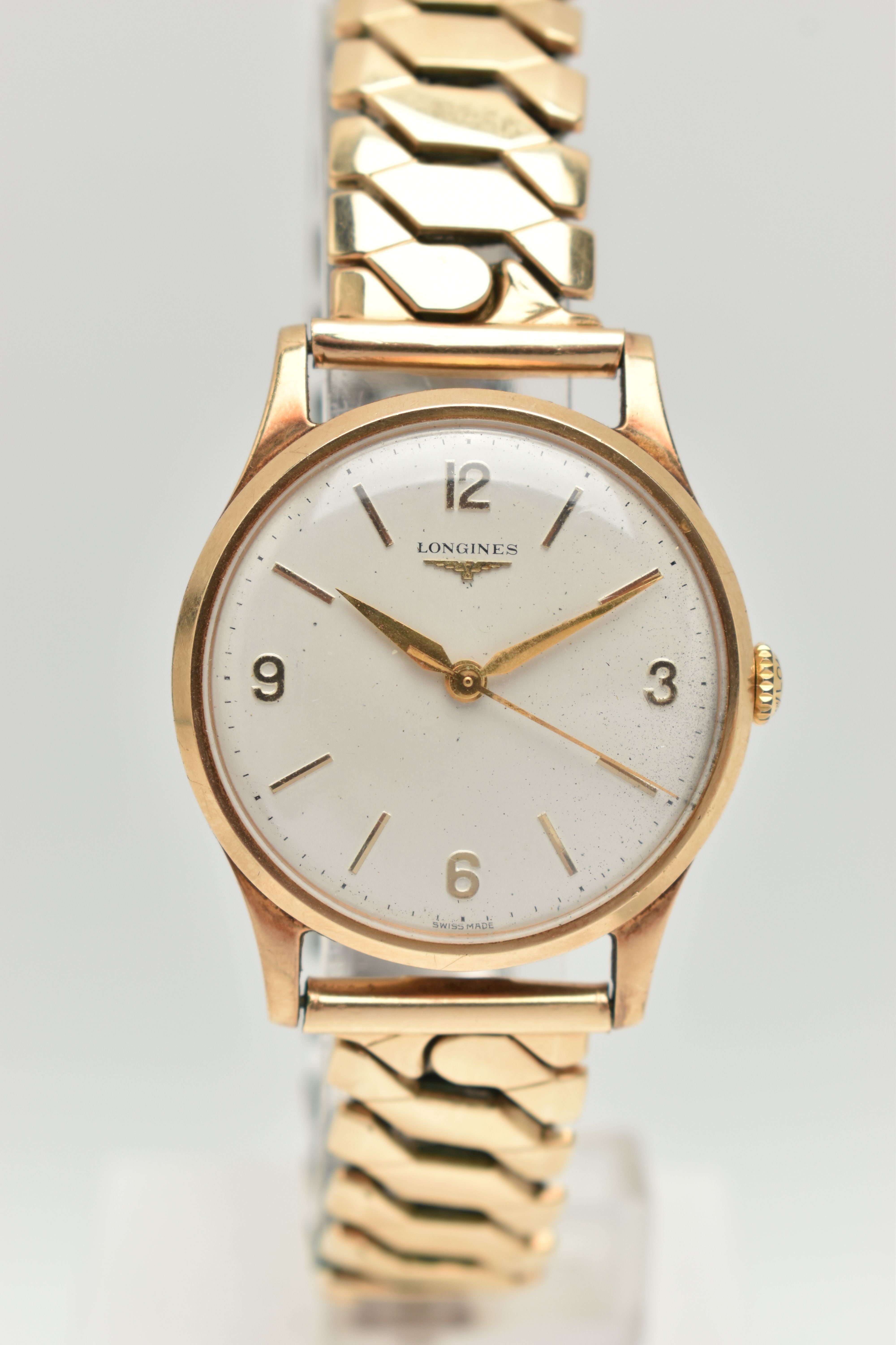 A GENTS 9CT GOLD 'LONGINES' WRISTWATCH, manual wind, round silver dial signed 'Longines', Arabic