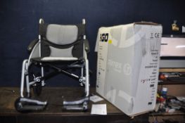 A BRAND NEW IN BOX IGO AIREX LT FOLDING WHEELCHAIR with manual and two footrests
