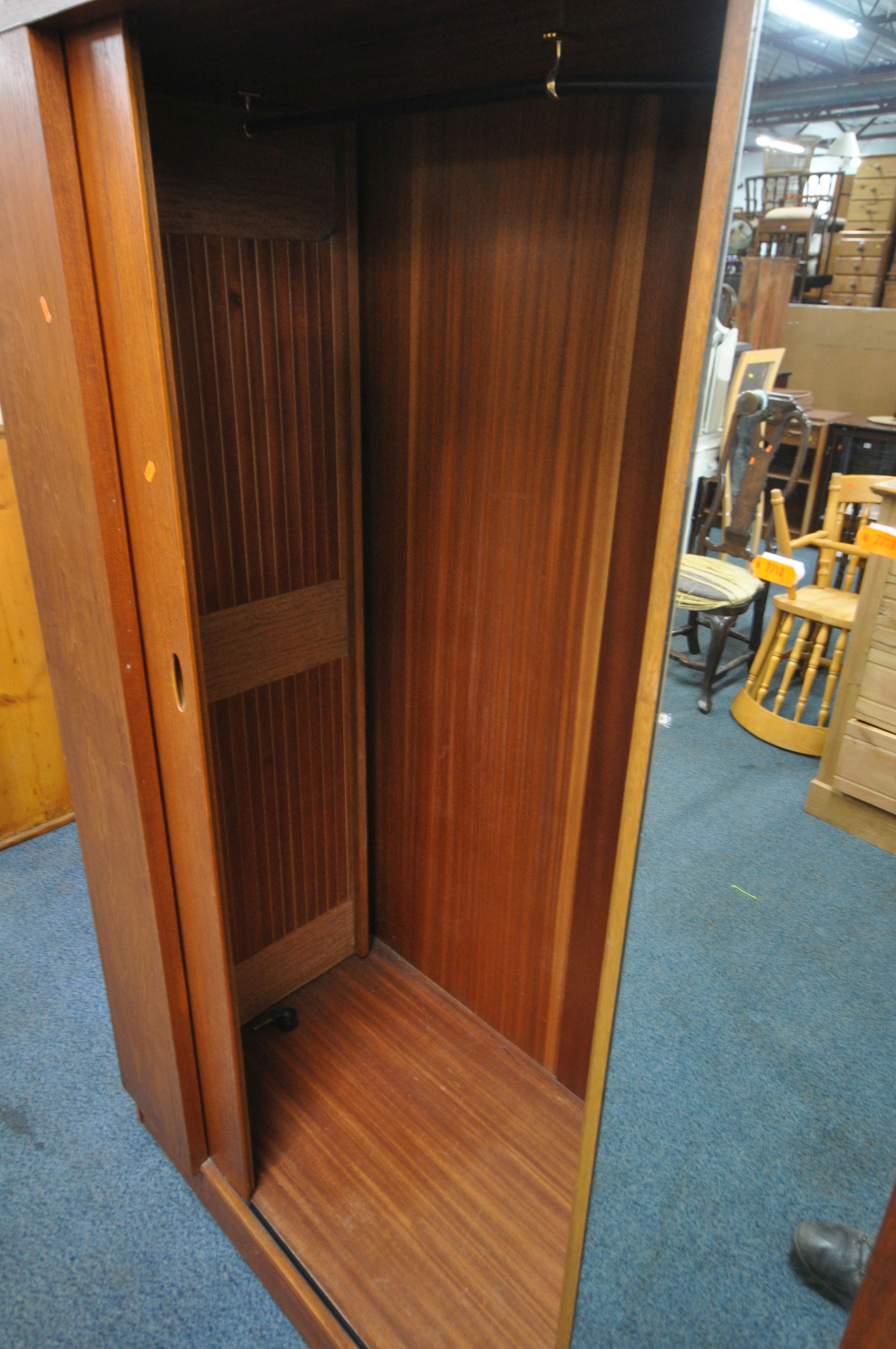 AN AUSTINSUITE MID CENTURY TEAK WARDROBE, with a single tambour sliding door and mirror, width 122cm - Image 4 of 4