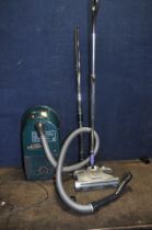 A GOBLIN WHISPER 1400 VACUUM CLEANER, a Halogen Heater(one of three bars not working)(both PAT