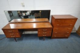 A MID CENTURY TEAK AUSTINSUITE DRESSING TABLE, with a rectangular mirror, six drawer, on cylindrical
