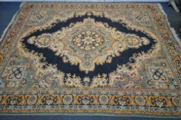 A LARGE MACHINE WOOLLEN RUG, foliate repeating pattern, with large central medallion and separated