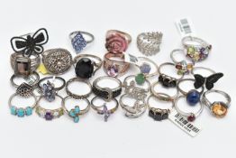 A SELECTION OF WHITE METAL RINGS, various designs, some set with semi-precious gemstones, marks to