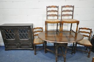 AN OAK BOOKCASE with two leaded glass cupboard doors over two smaller cupboard doors, length 109cm x