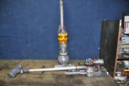 A DYSON DC50 UPRIGHT BALL VACUUM CLEANER (PAT pass and working) and a V7 Trigger hand held with wall