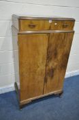 A 20TH CENTURY WALNUT TALLBOY, fitted with a single drawer above two cupboard doors, that are