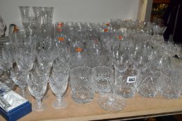 A QUANTITY OF CUT GLASS DRINKING GLASSES ETC, to include sets of large and small wine glasses,