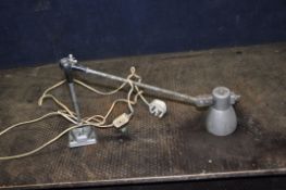 A VINTAGE INDUSTRIAL ARTICULATED INSPECTION LAMP with textures silver finish, a single joint and