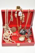 A RED JEWELLERY BOX WITH CONTENTS, to include imitation pearl necklaces, costume chains, novelty