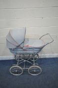 A SILVERCROSS PRAM, with grey and red basket, on tubular metal frame (condition report: some wear