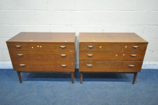 A PAIR OF WRIGHTON MID CENTURY TEAK CHEST OF THREE LONG DRAWERS, on cylindrical tapered legs, length