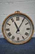 A GENTS OF LEICESTER CAST IRON WALL CLOCK, mains electric movement, orange painted border with three