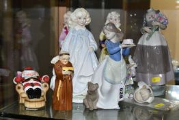 EIGHT FIGURINES OF GIRLS, LADIES AND FATHER CHRISTMAS, ETC, comprising a set of three Royal