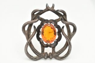 A 19TH CENTURY 'MACKAY' BROOCH, an oval cut Cairngorm, centrally set in a surround of stylised