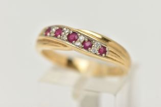 AN 18CT RUBY AND DIAMOND HALF ETERNITY RING, cross over design set with five circular cut rubies