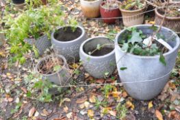 A PAIR OF GREY PAINTED COMPOSITE PLANTERS, diameter 36cm x height 32cm, along with three