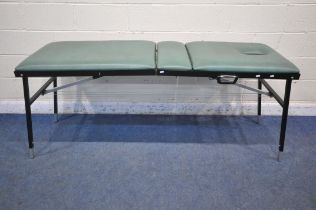 A FOLDING MASSAGE TABLE, with face rest hole, height adjustable backrest and legs, open length 197cm