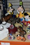 A GROUP OF PAPERWEIGHTS AND ORNAMENTS, comprising three Schmid Disney Music Boxes, a Beswick Mare (