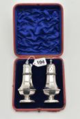 A PAIR OF CASED LATE VICTORIAN SALT AND PEPPER SHAKERS, a pair of octagonal baluster silver salt and