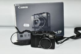 A BOXED CANON POWERSHOT G9 DIGITAL CAMERA, box contains instructions in Italian and German, software