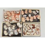 TWO SMALL BOXES OF LOOSE CAMEOS, oval carved shell cameos, mostly depicting women in profile (