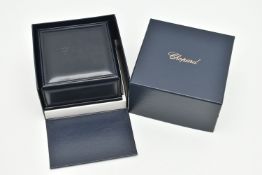 A CHOPARD RING BOX, a blue leather box embossed signed 'Chopard' together with outer box signed '
