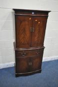 A 20TH CENTURY MAHOGANY STRONGBOW FURNITURE BOW FRONT COCKTAIL CABINET, fitted with four cupboard