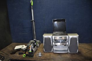 A GTECH 22V CORDLESS VACUUM CLEANER, a G Tech 22v handheld vacuum cleaner with accessories and one