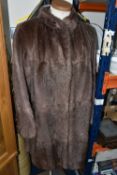 A THREE QUARTER LENGTH FUR COAT, comprising a dusty rose/taupe coloured ladies fur coat, Mandarin