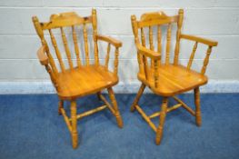 A PAIR OF PINE ARMCHAIRS, with spindle back and supports, turned legs and stretchers (condition