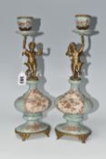 A PAIR OF REPRODUCTION TURQUOISE PORCELAIN AND BRASS FIGURAL CANDLEHOLDERS OF LATE 19TH CENTURY