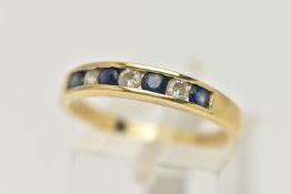 AN 18CT GOLD SAPPHIRE AND DIAMOND HALF ETERNITY RING, set with four deep blue circular cut